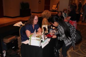 How cool is this?! I'm signing a reader's Kindle cover!